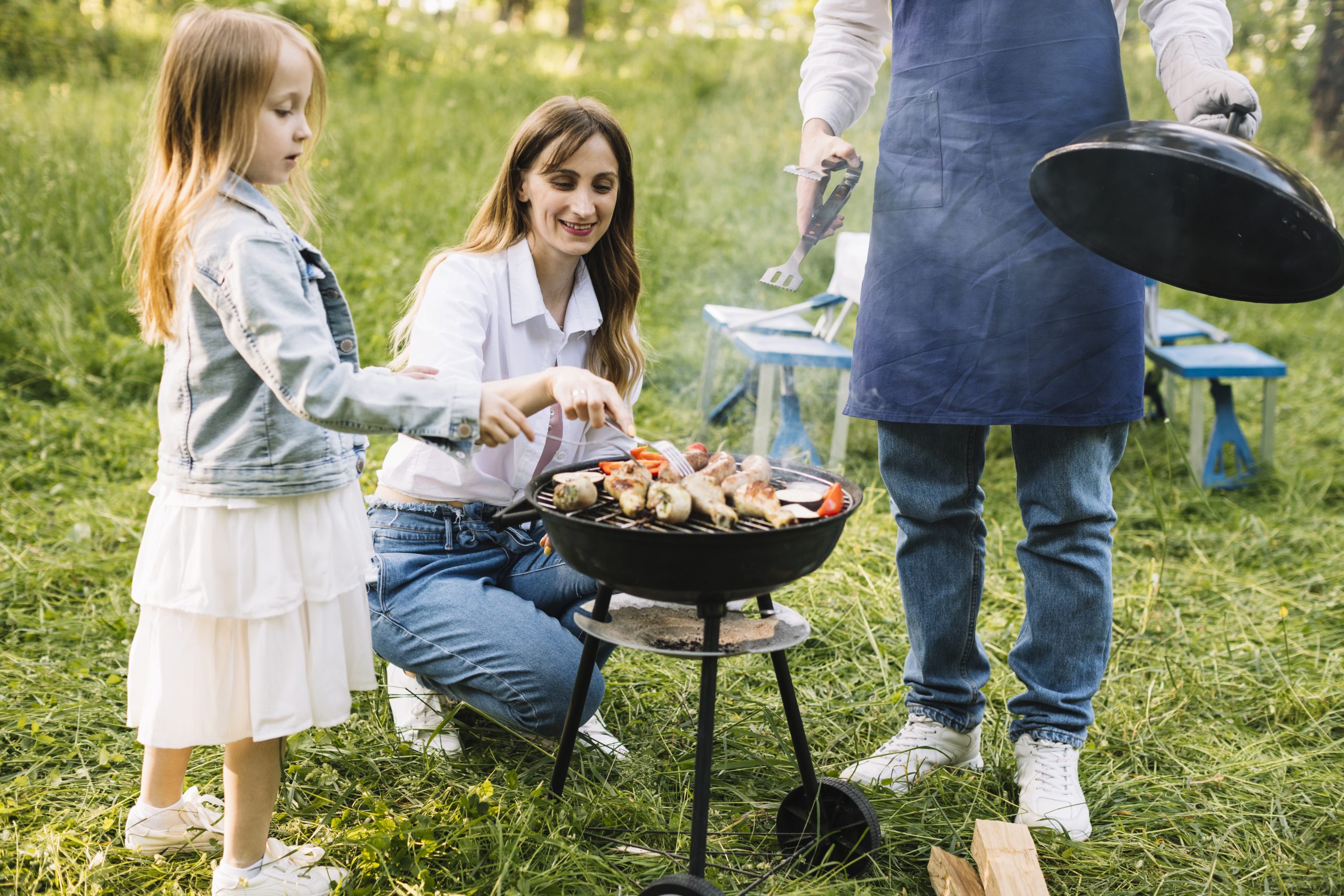 family-doing-barbecue-nature
